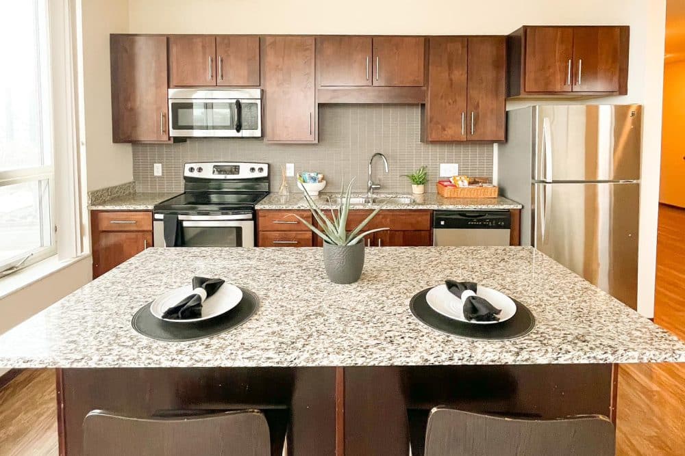 the knoll dinkytown apartments near the university of minnesota kitchen extra wide island with seating stainless steel appliances granite countertops