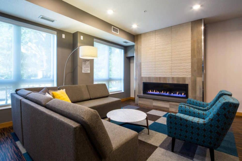 the knoll dinkytown off campus apartments near the university of minnesota resident clubhouse lounge with fireplace